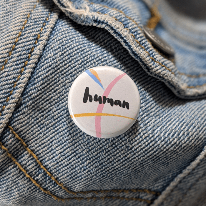 human button worn on jean jacket